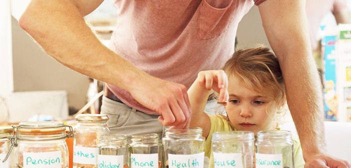 parent and child putting money in jars