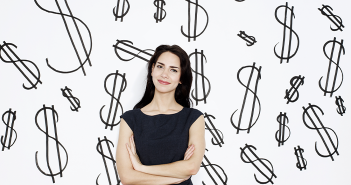 woman in front of dollar signs