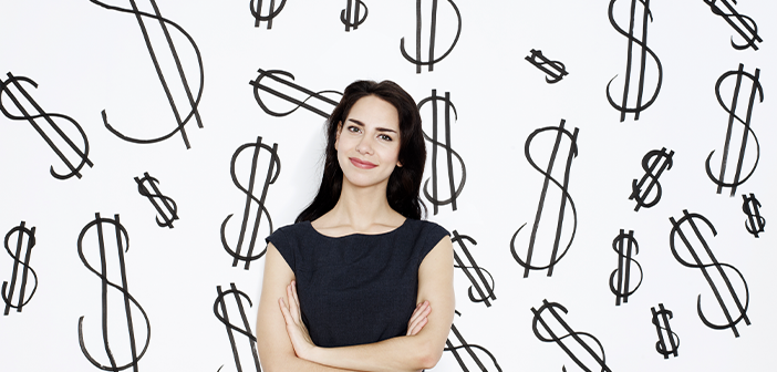 woman in front of dollar signs
