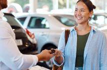 Person handing keys to another person