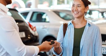 Making Your Next Car More Affordable: Car Loan Interest Deduction For U.S.-Assembled Vehicles And FIGFCU Auto Loans Person handing keys to another person