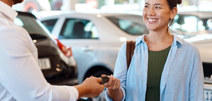 Person handing keys to another person