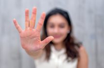 Person holding out her hand.