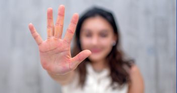 Person holding out her hand.