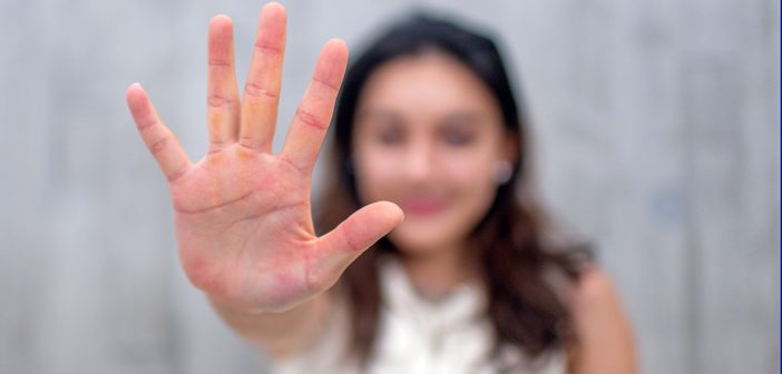 Person holding out her hand.
