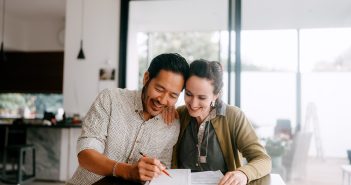 Couple looking over paperwork.