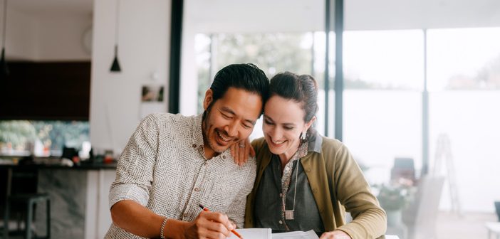 Couple looking over paperwork.