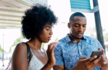 Couple looking at their phone