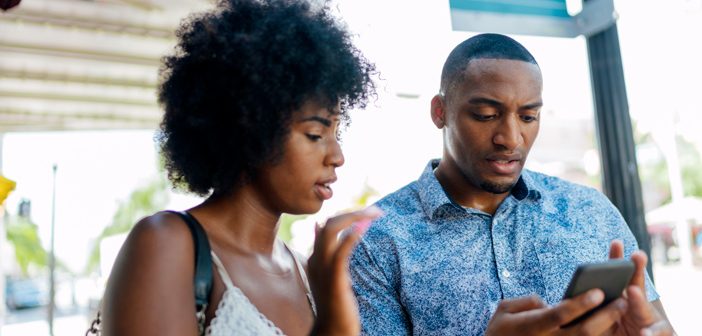 Couple looking at their phone