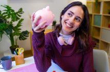 Person holding a piggy bank