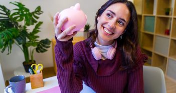 Person holding a piggy bank
