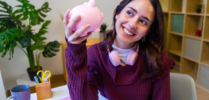 Person holding a piggy bank